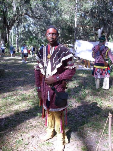 Blacks and Seminoles- A Black Seminole descendant in authentic war dress at a re-enactment of the Dade Battle. Dunn Collection