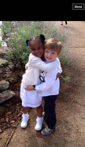 Children Friends hugging Frederick D. Johnson's grand daughter and friend 